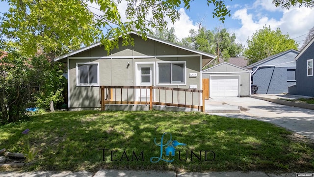 1235 S Durbin St, Casper, WY 82601 - view of front of home with driveway, an outdoor structure, and a front lawn