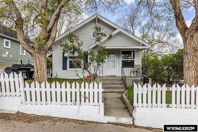 804 Connecticut Ave, Rock Springs, WY 82901 - bungalow-style home with a fenced front yard and a porch