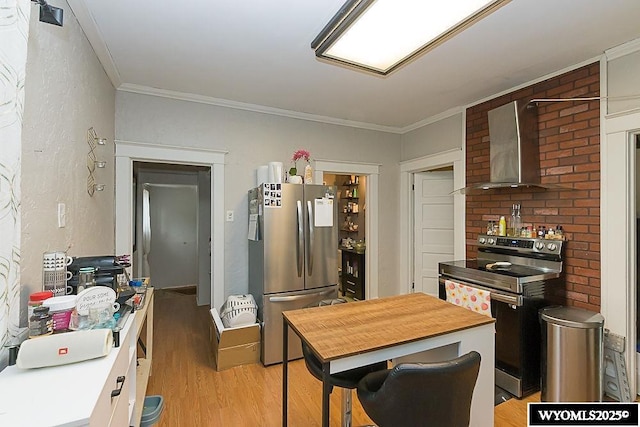804 Connecticut Ave, Rock Springs, WY 82901 - kitchen featuring appliances with stainless steel finishes, light wood finished floors, wall chimney exhaust hood, and ornamental molding