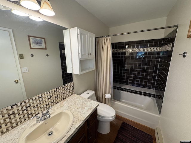 302 Clearview St, Saratoga, WY 82331 - full bath with vanity, toilet, shower / bath combo with shower curtain, and tasteful backsplash