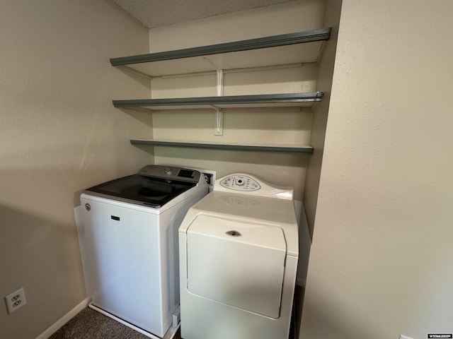 302 Clearview St, Saratoga, WY 82331 - laundry area featuring washer and dryer, baseboards, and carpet floors