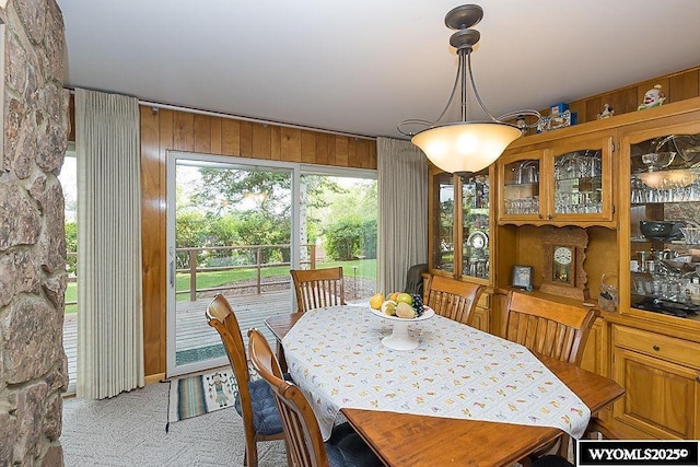 1823 Walnut St, Rock Springs, WY 82901 - carpeted dining area featuring wooden walls