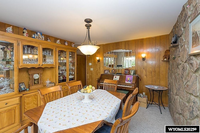 1823 Walnut St, Rock Springs, WY 82901 - dining space featuring light carpet and wood walls