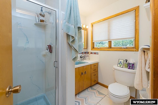1823 Walnut St, Rock Springs, WY 82901 - bathroom featuring a shower stall, toilet, vanity, and decorative backsplash