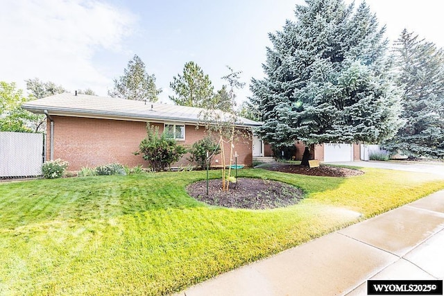 1823 Walnut St, Rock Springs, WY 82901 - view of front of house featuring driveway and brick siding