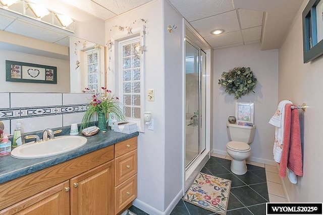 1823 Walnut St, Rock Springs, WY 82901 - full bath featuring vanity, toilet, tile patterned floors, a stall shower, and baseboards