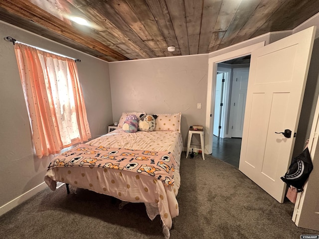 1023Pine Ave, Kemmerer, WY 83101 - bedroom with dark colored carpet and wooden ceiling