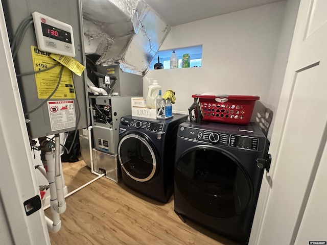 1023Pine Ave, Kemmerer, WY 83101 - laundry room with light wood-style flooring and independent washer and dryer