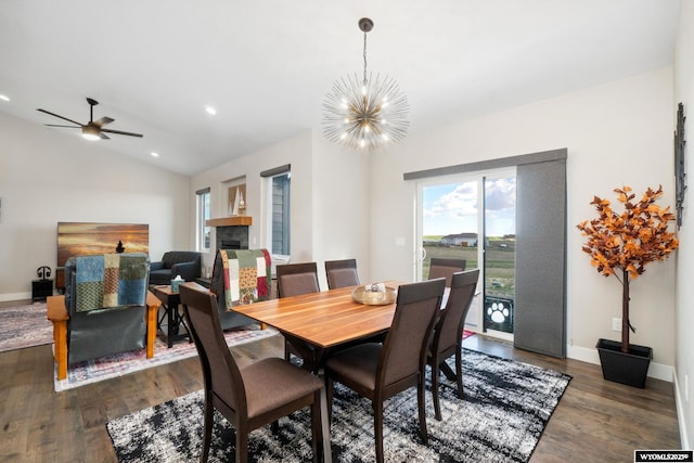 2352 Old Faithful Way, Cheyenne, WY 82009 - dining space featuring wood finished floors, a chandelier, a ceiling fan, baseboards, and lofted ceiling