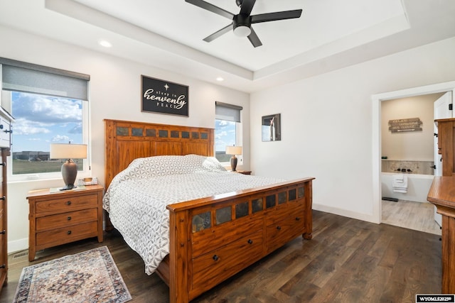 2352 Old Faithful Way, Cheyenne, WY 82009 - bedroom featuring a raised ceiling, dark wood-style flooring, recessed lighting, baseboards, and a ceiling fan