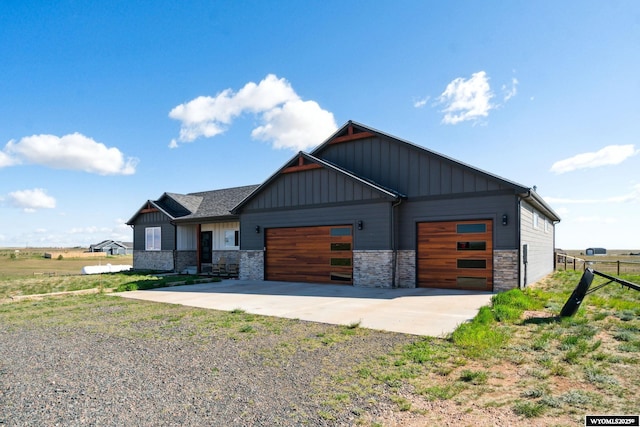 2352 Old Faithful Way, Cheyenne, WY 82009 - view of front of property featuring concrete driveway, stone siding, board and batten siding, and an attached garage