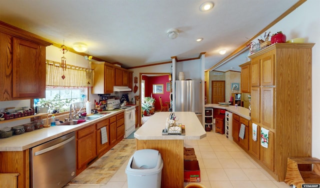 203 Rendezvous Rd, Riverton, WY 82501 - kitchen featuring stainless steel appliances, a sink, light countertops, a center island, and light tile patterned flooring