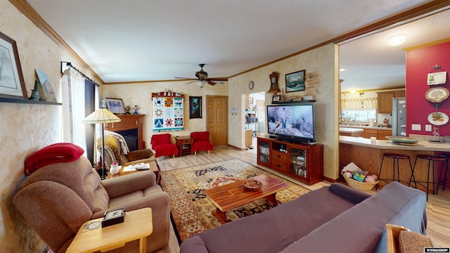 203 Rendezvous Rd, Riverton, WY 82501 - living area featuring light wood-style floors, crown molding, ceiling fan, and wallpapered walls
