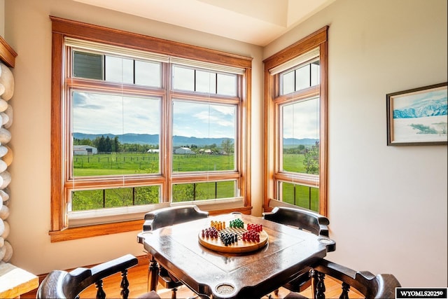 22 Pleasant Valley Ln, Sheridan, WY 82801 - dining area featuring healthy amount of natural light, a mountain view, and wood finished floors