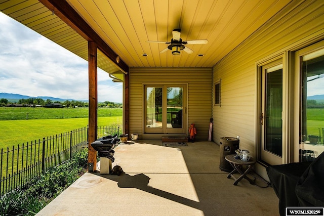 22 Pleasant Valley Ln, Sheridan, WY 82801 - view of patio / terrace featuring ceiling fan and a mountain view