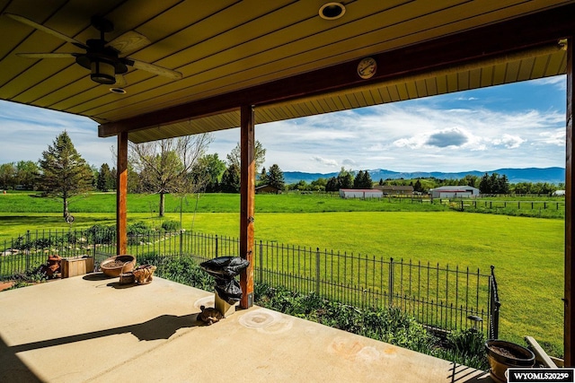 22 Pleasant Valley Ln, Sheridan, WY 82801 - view of patio / terrace with a mountain view, a rural view, and ceiling fan