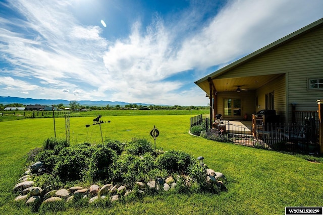 22 Pleasant Valley Ln, Sheridan, WY 82801 - view of yard with ceiling fan, a patio area, a mountain view, and a view of countryside
