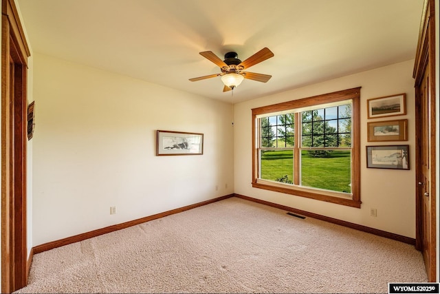 22 Pleasant Valley Ln, Sheridan, WY 82801 - unfurnished room featuring light carpet, baseboards, and a ceiling fan