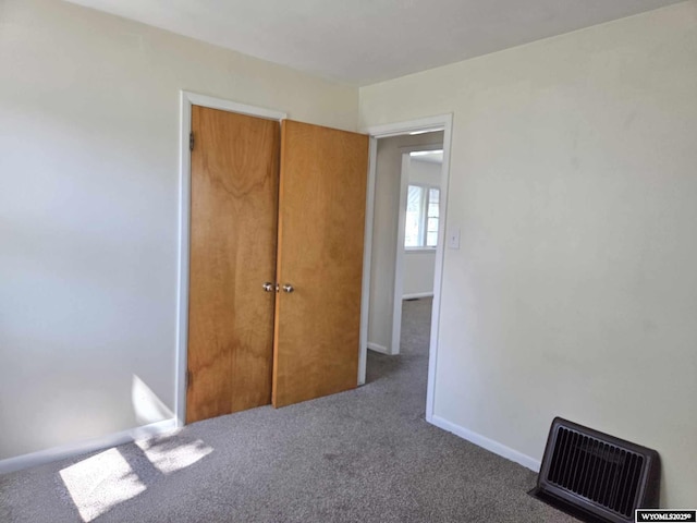 1308 Howell, Worland, WY 82401 - unfurnished bedroom featuring carpet flooring and baseboards