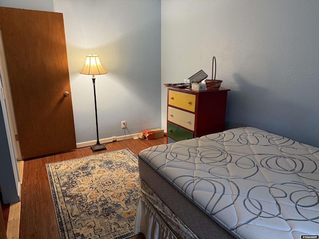83 Calvert Ave, Hanna, WY 82327 - bedroom with wood finished floors and baseboards
