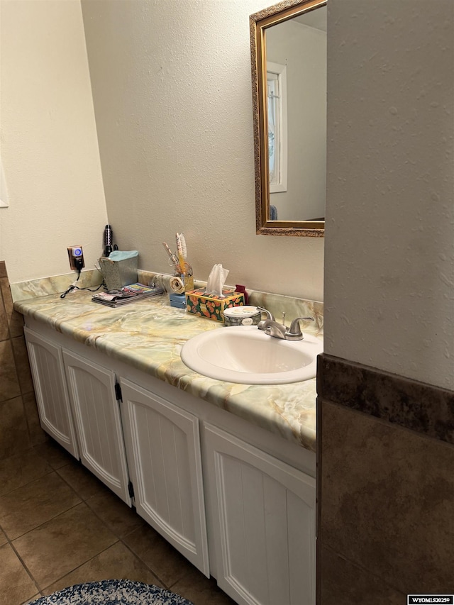 83 Calvert Ave, Hanna, WY 82327 - bathroom with vanity and tile patterned floors