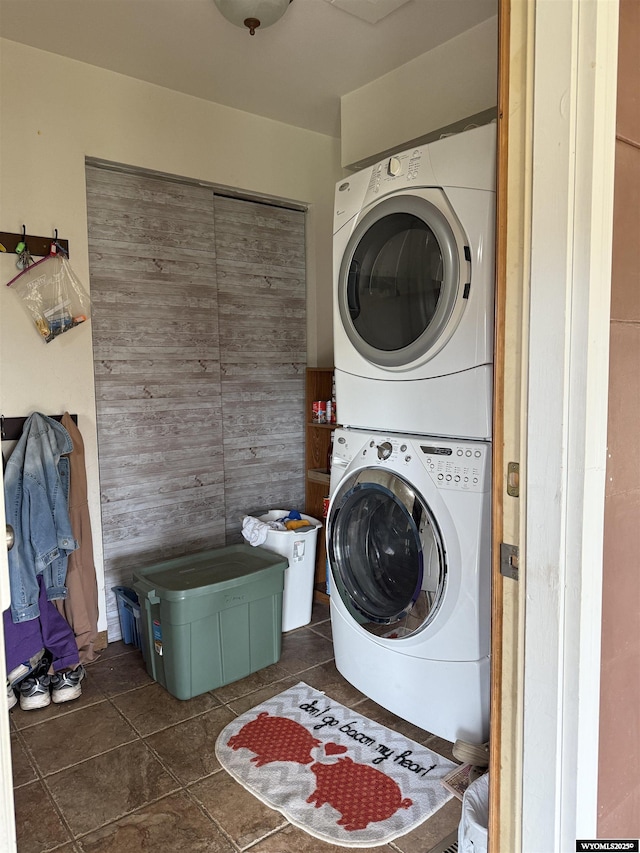 83 Calvert Ave, Hanna, WY 82327 - laundry area featuring stacked washer / drying machine and tile patterned floors