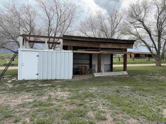 83 Calvert Ave, Hanna, WY 82327 - view of pole building featuring a lawn