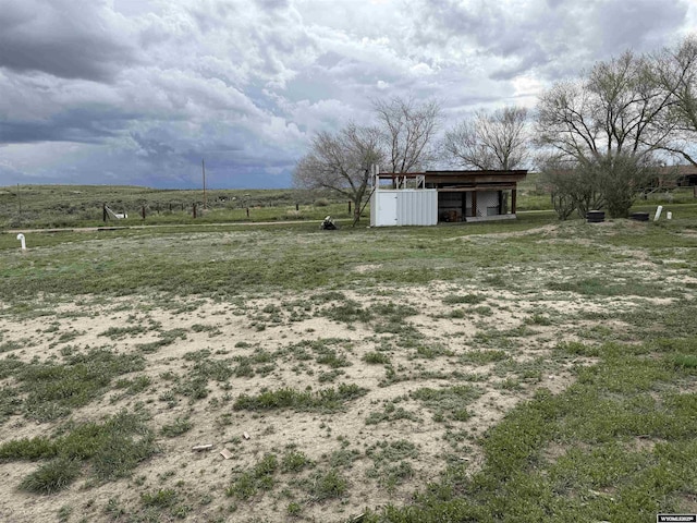 83 Calvert Ave, Hanna, WY 82327 - view of yard featuring a view of countryside, an outdoor structure, and a pole building