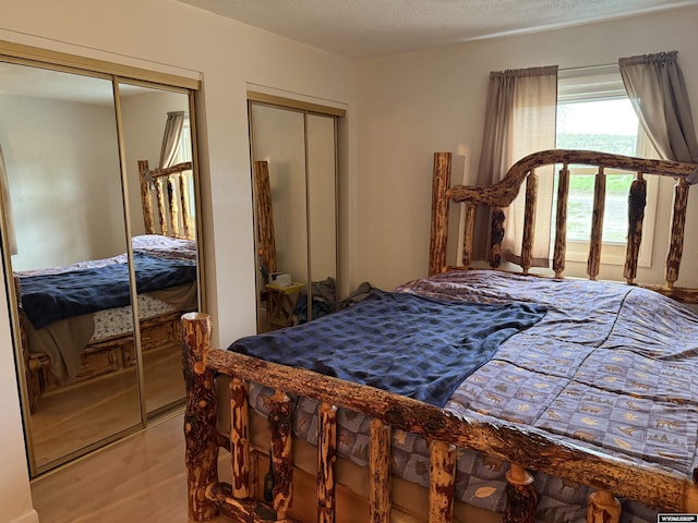 83 Calvert Ave, Hanna, WY 82327 - bedroom with multiple closets and light wood-type flooring