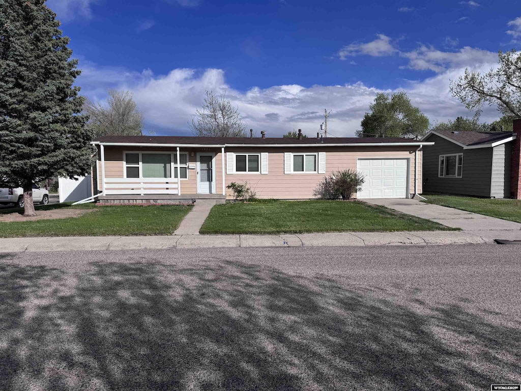 1001 Trigood, Casper, WY 82609 - single story home featuring a garage, driveway, and a front yard