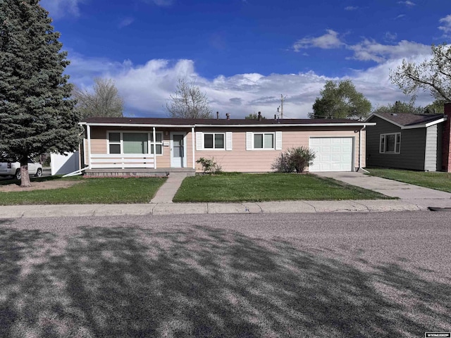 1001 Trigood, Casper, WY 82609 - single story home featuring a garage, driveway, and a front yard