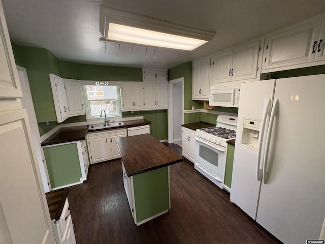 420 S 6th St, Riverton, WY 82501 - kitchen featuring white appliances, a sink, butcher block counters, a center island, and white cabinets