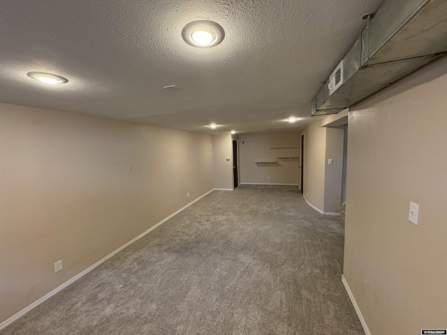420 S 6th St, Riverton, WY 82501 - finished below grade area featuring a textured ceiling, carpet flooring, and baseboards