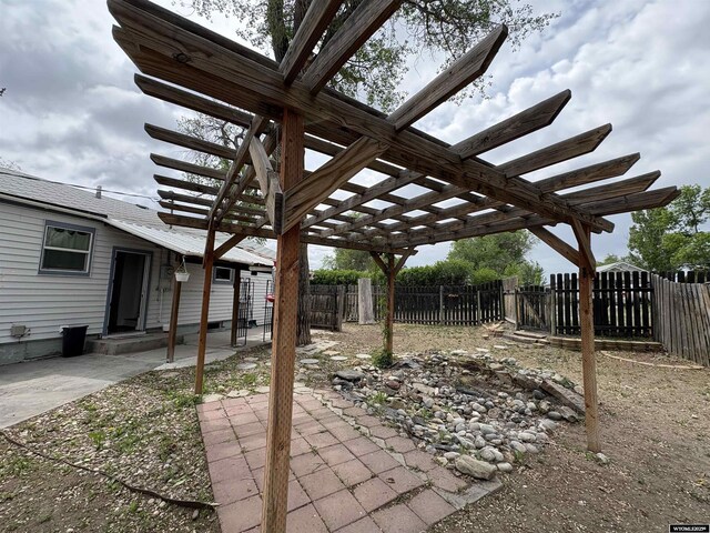 420 S 6th St, Riverton, WY 82501 - fenced backyard with a pergola and a patio