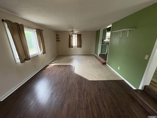 420 S 6th St, Riverton, WY 82501 - unfurnished room featuring plenty of natural light, light wood-style flooring, baseboards, a textured ceiling, and a ceiling fan