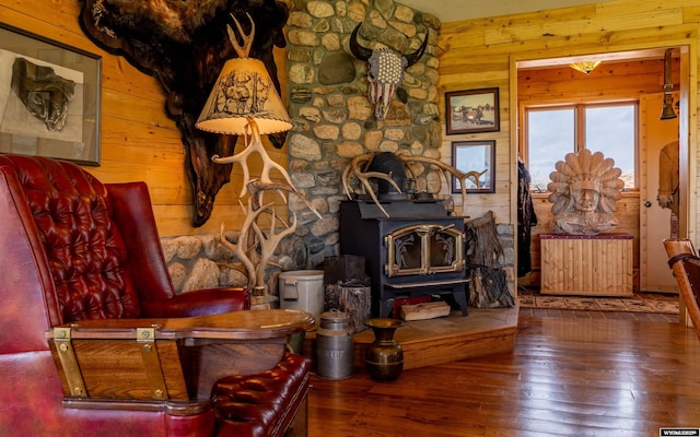 30 Nielsen Trl, Cody, WY 82414 - living area with a wood stove, wood-type flooring, and wooden walls