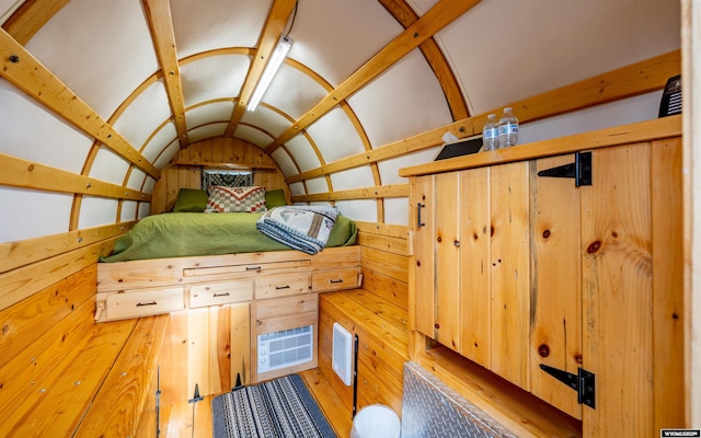 30 Nielsen Trl, Cody, WY 82414 - bedroom featuring vaulted ceiling and wood finished floors