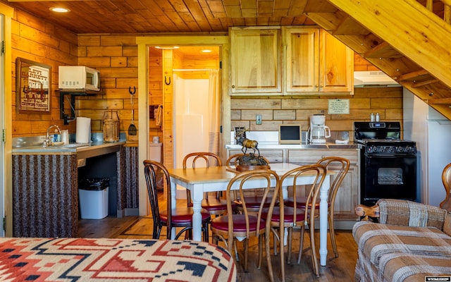 30 Nielsen Trl, Cody, WY 82414 - dining room with wood finished floors, wood walls, wood ceiling, and recessed lighting