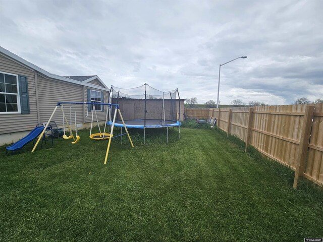 212 Vero Ln, Buffalo, WY 82834 - view of yard with a trampoline and a playground