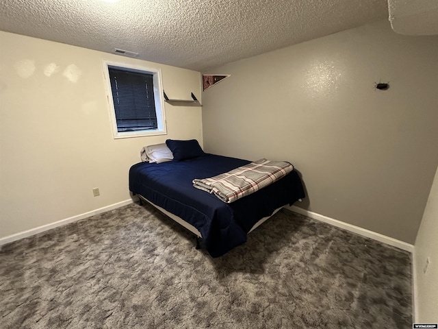 4 Meadowgreen Pl, Douglas, WY 82633 - carpeted bedroom featuring a textured ceiling and baseboards