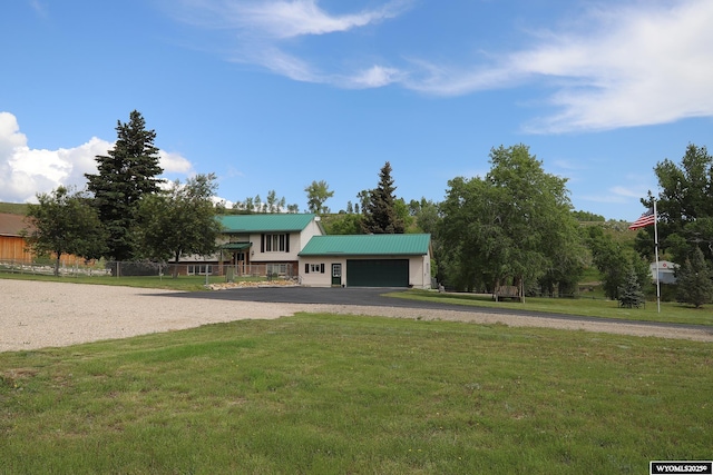 478 Upper French Creek Rd, Buffalo, WY 82834 - split level home featuring a front yard, driveway, an attached garage, and metal roof