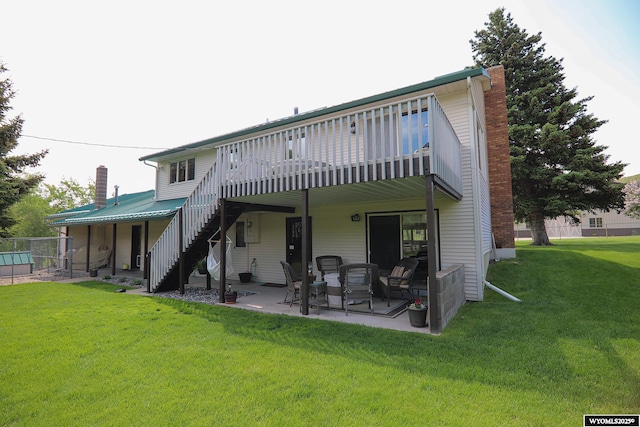 478 Upper French Creek Rd, Buffalo, WY 82834 - rear view of house with a chimney, stairway, a yard, a patio area, and a wooden deck