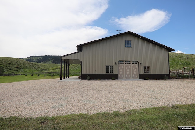 478 Upper French Creek Rd, Buffalo, WY 82834 - view of property exterior featuring a detached garage, an outdoor structure, and a pole building