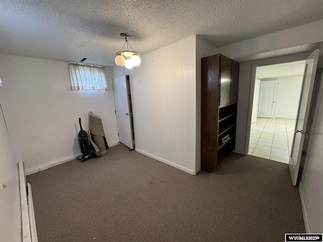 402 S 7th St E, Riverton, WY 82501 - empty room with carpet, a textured ceiling, and baseboards