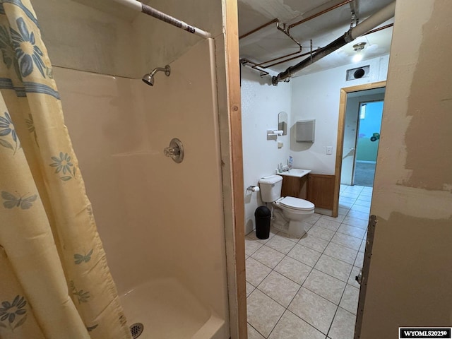 402 S 7th St E, Riverton, WY 82501 - full bath featuring a shower stall, tile patterned flooring, toilet, and vanity