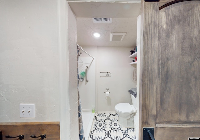 737 Cascade St, Lander, WY 82520 - full bathroom with a shower, toilet, and tile patterned floors