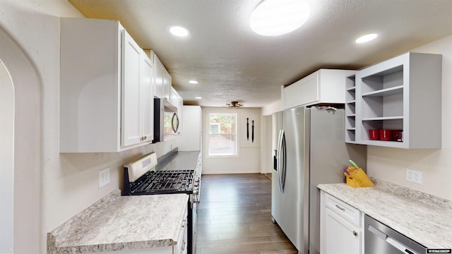 737 Cascade St, Lander, WY 82520 - kitchen featuring appliances with stainless steel finishes, open shelves, white cabinets, recessed lighting, and dark wood-type flooring