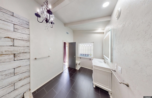 737 Cascade St, Lander, WY 82520 - bathroom with vanity, a chandelier, beamed ceiling, and tile patterned flooring