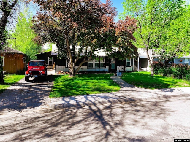 737 Cascade St, Lander, WY 82520 - obstructed view of property with driveway and a front lawn