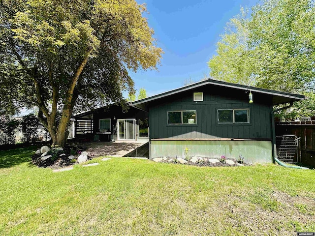 737 Cascade St, Lander, WY 82520 - rear view of house featuring board and batten siding